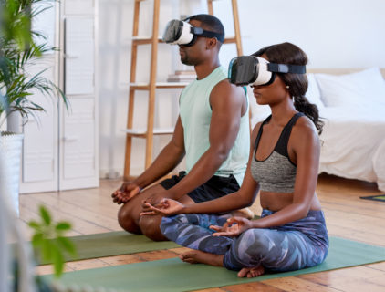 couple meditating using VR headsets