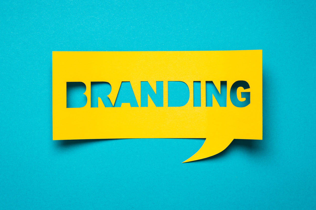the word branding in yellow on a turquoise background