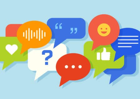 Illustration of colourful speech bubbles featuring social media icons such as a heart, thumbs up, quotation marks, smiley face, and question mark—representing digital conversations and online engagement.